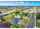 Aerial view showcasing a property's boundaries and surrounding houses with pool in a residential community at 262 Rotonda N Blvd, Rotonda West, FL 33947