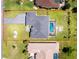 Aerial view of a well-maintained property with a backyard swimming pool and lush green landscaping at 262 Rotonda N Blvd, Rotonda West, FL 33947