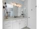 Bathroom with white cabinets, quartz countertop, and walk in shower at 262 Rotonda N Blvd, Rotonda West, FL 33947
