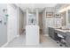 Modern bathroom with double vanity, walk-in shower with seating and decorative accents at 262 Rotonda N Blvd, Rotonda West, FL 33947
