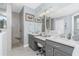 Coastal-themed bathroom featuring dual vanities, a spacious tiled shower, and decor accents at 262 Rotonda N Blvd, Rotonda West, FL 33947