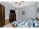 Cozy bedroom featuring a patterned duvet, ample storage and a ceiling fan at 262 Rotonda N Blvd, Rotonda West, FL 33947