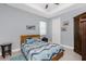 Bright bedroom with coastal themed bedding, side table and nautical decor at 262 Rotonda N Blvd, Rotonda West, FL 33947