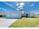 Charming single-story home boasting a three-car garage, well-manicured lawn, and appealing curb appeal at 262 Rotonda N Blvd, Rotonda West, FL 33947