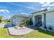 Charming single-story home with a well-maintained front lawn and meticulous landscaping surrounding the walkway to the front door at 262 Rotonda N Blvd, Rotonda West, FL 33947