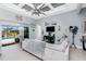 Comfortable living room with access to the pool, tile floors, and stylish furnishings in an open-concept design at 262 Rotonda N Blvd, Rotonda West, FL 33947