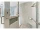 Beautiful tiled shower with mosaic accents, built-in niche, bench seat and showerhead at 262 Rotonda N Blvd, Rotonda West, FL 33947