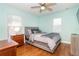 Charming bedroom with hardwood floors and a ceiling fan at 26294 Bridgewater Rd, Punta Gorda, FL 33983