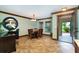 Inviting dining room boasts a wooden table, chandelier, and decorative molding, perfect for gatherings at 26294 Bridgewater Rd, Punta Gorda, FL 33983