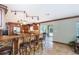 Spacious kitchen featuring a breakfast bar, granite countertops, custom cabinetry, and stainless steel appliances at 26294 Bridgewater Rd, Punta Gorda, FL 33983