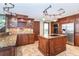 A well-appointed kitchen showcasing a large island, custom cabinets, granite countertops, and stainless steel appliances at 26294 Bridgewater Rd, Punta Gorda, FL 33983