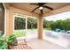 Relaxing screened-in lanai offering comfortable seating and views of the beautiful backyard at 26294 Bridgewater Rd, Punta Gorda, FL 33983