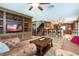 Spacious living room open to kitchen with media center, bar seating, and tile flooring throughout at 26294 Bridgewater Rd, Punta Gorda, FL 33983