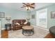 Comfortable living room featuring a plush sofa, soft lighting, and a serene atmosphere at 26294 Bridgewater Rd, Punta Gorda, FL 33983
