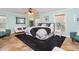 Bright and spacious main bedroom with a large bed, modern decor, and plenty of natural light at 26294 Bridgewater Rd, Punta Gorda, FL 33983