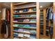Spacious walk-in closet with custom shelving and ample storage for clothing and accessories at 26294 Bridgewater Rd, Punta Gorda, FL 33983