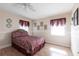 Cozy bedroom featuring natural light, neutral walls, and a decorative comforter set at 3085 Crowder St, Punta Gorda, FL 33980