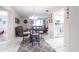 Open concept dining area featuring tile flooring, chandelier, and access to kitchen and living areas at 3085 Crowder St, Punta Gorda, FL 33980