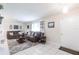 Bright living room with tile flooring, comfortable seating, and neutral decor creating a welcoming atmosphere at 3085 Crowder St, Punta Gorda, FL 33980