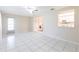 Open-concept living room with tile flooring and a pass-through to the kitchen at 3085 Crowder St, Punta Gorda, FL 33980