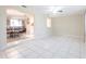 Open-concept living room with tile flooring, access to the kitchen and dining area at 3085 Crowder St, Punta Gorda, FL 33980