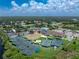 Aerial view showcasing the community's various tennis courts and ammenities at 3207 Village Ln, Port Charlotte, FL 33953