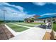 Relaxing bocce ball court adjacent to the clubhouse on a sunny day at 3207 Village Ln, Port Charlotte, FL 33953