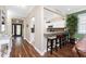 Hallway view into kitchen with breakfast bar, stools, and living area at 3207 Village Ln, Port Charlotte, FL 33953
