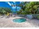 The community offers a tranquil hot tub surrounded by palms for relaxation and enjoyment at 3207 Village Ln, Port Charlotte, FL 33953