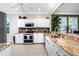 Well-equipped kitchen featuring granite countertops, stainless steel appliances, and ample cabinet space at 3207 Village Ln, Port Charlotte, FL 33953
