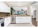 Kitchen with white cabinets, granite countertops, and stainless steel appliances at 3207 Village Ln, Port Charlotte, FL 33953