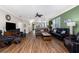 Expansive living room featuring hardwood floors, neutral paint, and a view to the entry at 3207 Village Ln, Port Charlotte, FL 33953