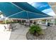 Another beautiful outdoor seating area under the large blue canopy at 3207 Village Ln, Port Charlotte, FL 33953