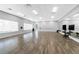Spacious dance studio features wood floors, mirrored wall and recessed lighting at 3207 Village Ln, Port Charlotte, FL 33953