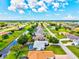 Aerial view of a waterfront community highlighting homes with pools and meticulously kept landscaping at 34 Broadmoor Ln, Rotonda West, FL 33947