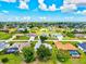 An aerial view of a sprawling neighborhood with lush greenery, canals, and beautiful homes at 34 Broadmoor Ln, Rotonda West, FL 33947