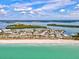 Expansive aerial view showcasing the beach, community, and surrounding waterways at 34 Broadmoor Ln, Rotonda West, FL 33947