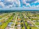 Beautiful aerial view of a Florida neighborhood with canal access and a community pool at 34 Broadmoor Ln, Rotonda West, FL 33947