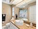 Bathroom vanity with granite countertops, a large mirror, and a decorative shower curtain at 34 Broadmoor Ln, Rotonda West, FL 33947