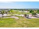 Scenic view of lush golf course with sand traps and scattered trees at 34 Broadmoor Ln, Rotonda West, FL 33947