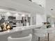 The modern kitchen is well-lit and features gray shaker cabinets, stainless steel appliances and a breakfast bar at 34 Broadmoor Ln, Rotonda West, FL 33947