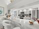 This kitchen features light gray cabinets, stainless appliances, and white countertops at 34 Broadmoor Ln, Rotonda West, FL 33947