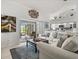 Bright and inviting living room with sliding glass doors to the outdoor patio at 34 Broadmoor Ln, Rotonda West, FL 33947
