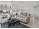 Bright living room featuring neutral furniture, decor, and tile flooring, perfect for comfortable living and entertaining at 34 Broadmoor Ln, Rotonda West, FL 33947