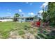Home features a fire pit with chairs in the backyard, perfect for entertaining at 55 Mark Twain Ln, Rotonda West, FL 33947