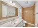 Bathroom featuring tile floor, spacious shower, large mirror, and vanity, offering a functional and modern space at 55 Mark Twain Ln, Rotonda West, FL 33947