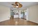 Comfortable dining area with neutral walls, ceiling fan, sliding glass door with access to the enclosed patio at 55 Mark Twain Ln, Rotonda West, FL 33947