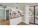 Bright kitchen featuring stainless steel appliances, tile floors, and a breakfast bar perfect for casual dining at 55 Mark Twain Ln, Rotonda West, FL 33947
