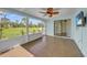 Inviting lanai featuring tile flooring and picturesque views of the lush, green landscape at 55 Mark Twain Ln, Rotonda West, FL 33947