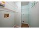 Well-organized laundry room with ample shelving and clean, neutral walls at 55 Mark Twain Ln, Rotonda West, FL 33947